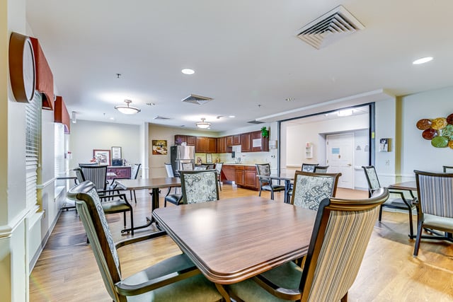 tables with green chairs